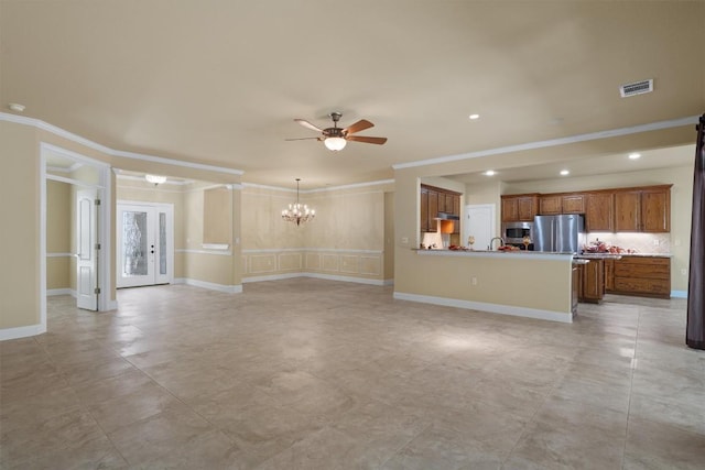 103 Nueces Trl, Georgetown, TX 78633 - unfurnished living room with ceiling fan, ornamental molding, a chandelier, recessed lighting, and a sink