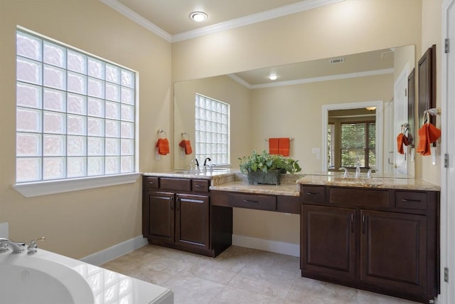 103 Nueces Trl, Georgetown, TX 78633 - bathroom with crown molding, a bath, vanity, tile patterned flooring, and baseboards