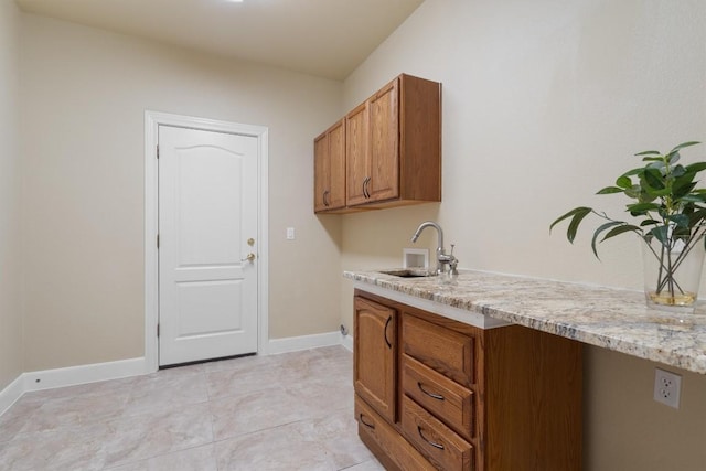 103 Nueces Trl, Georgetown, TX 78633 - laundry area with washer hookup, cabinet space, and baseboards
