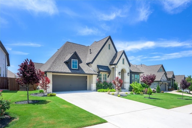 6108 Antelope Well Ln, Austin, TX 78738 - french provincial home featuring driveway, roof with shingles, an attached garage, and stone siding