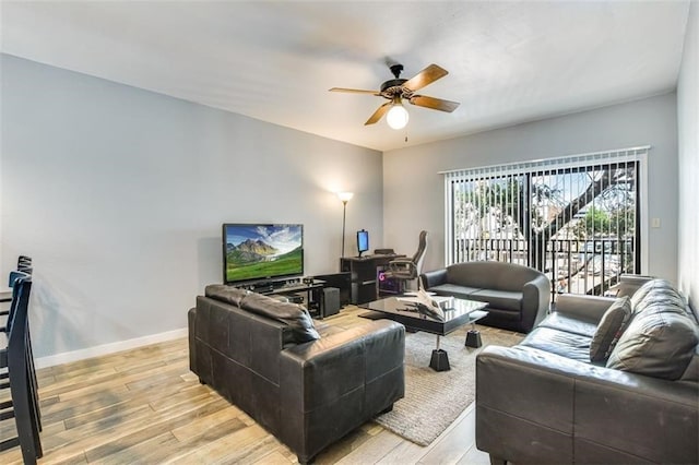 1908 San Antonio St Unit 213, Austin, TX 78705 - living area featuring ceiling fan, light wood-style floors, and baseboards