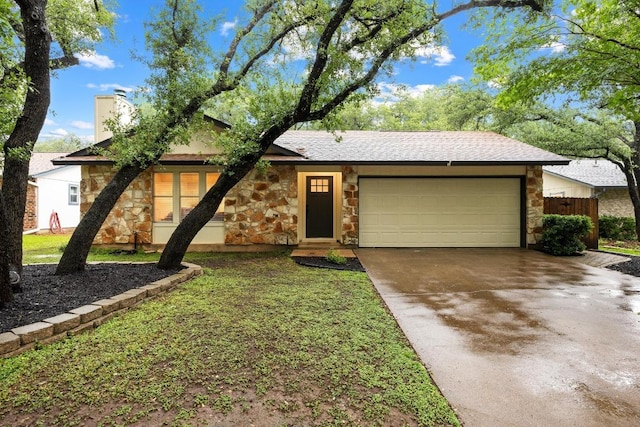 4210 Harcourt Dr, Austin, TX 78727 - view of front facade with stone siding, an attached garage, concrete driveway, fence, and a chimney