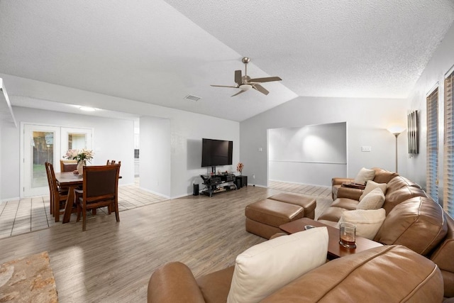 4210 Harcourt Dr, Austin, TX 78727 - living room featuring a ceiling fan, light wood-style floors, vaulted ceiling, and baseboards