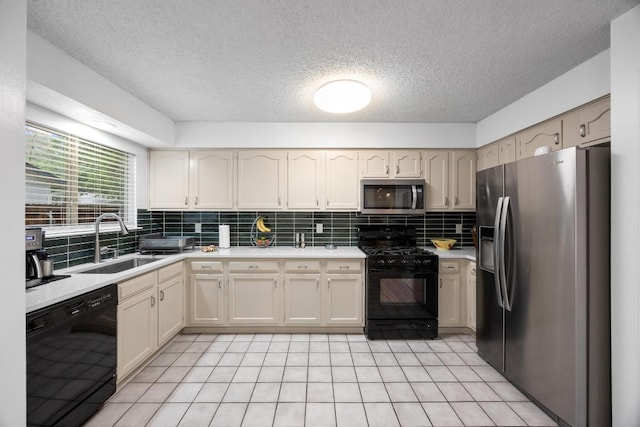 4210 Harcourt Dr, Austin, TX 78727 - kitchen featuring black appliances, a sink, light countertops, decorative backsplash, and a textured ceiling