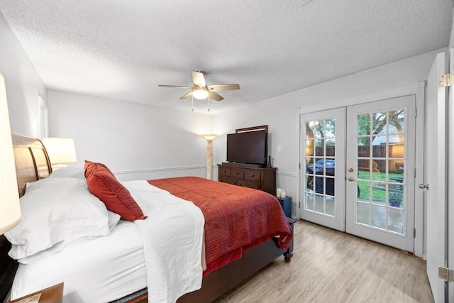 4210 Harcourt Dr, Austin, TX 78727 - bedroom with french doors, access to outside, a textured ceiling, wood finished floors, and ceiling fan