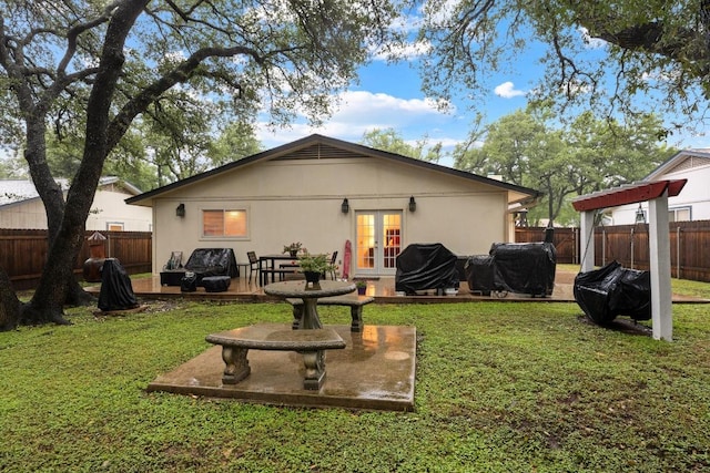 4210 Harcourt Dr, Austin, TX 78727 - back of property with french doors and stucco siding