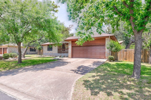 10804 Buckthorn Dr, Austin, TX 78759 - view of front facade with driveway, a garage, stone siding, and brick siding