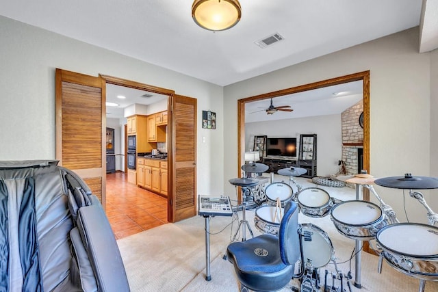 10804 Buckthorn Dr, Austin, TX 78759 - dining space with a ceiling fan, light tile patterned floors, and a brick fireplace