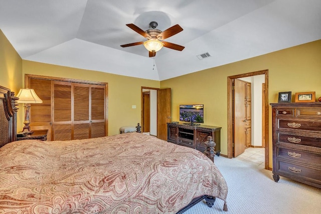 10804 Buckthorn Dr, Austin, TX 78759 - bedroom with light colored carpet, vaulted ceiling, a closet, and a ceiling fan