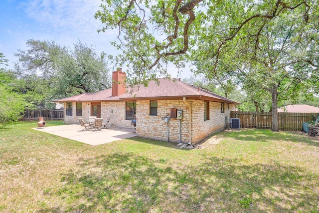 10804 Buckthorn Dr, Austin, TX 78759 - rear view of property featuring a chimney, stone siding, a fenced backyard, and a patio area