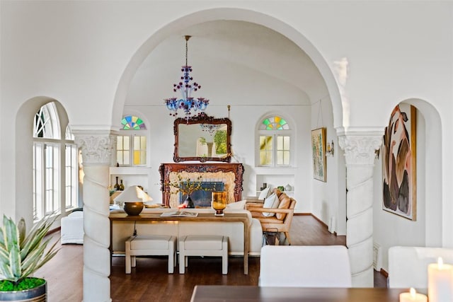 806 Rosedale Ter, Austin, TX 78704 - sitting room featuring wood finished floors, arched walkways, and a fireplace