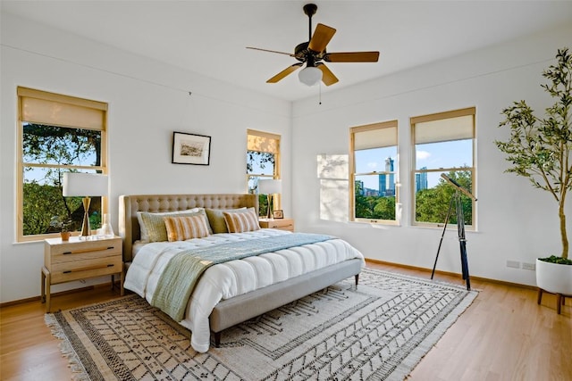 806 Rosedale Ter, Austin, TX 78704 - bedroom with light wood-style flooring, baseboards, and a ceiling fan