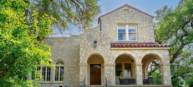 806 Rosedale Ter, Austin, TX 78704 - view of front of home featuring stone siding and a tile roof