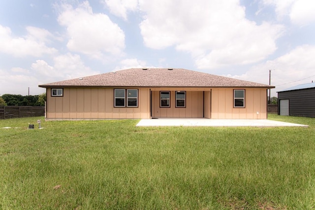 121 Grassy Ln, Elgin, TX 78621 - rear view of house featuring a patio area, board and batten siding, and roof with shingles
