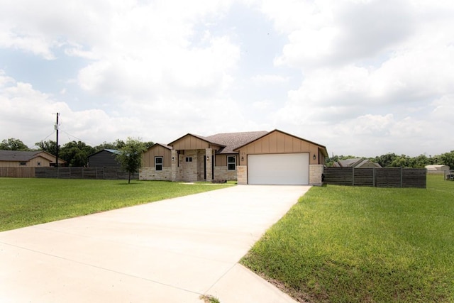 121 Grassy Ln, Elgin, TX 78621 - view of front of house with board and batten siding, an attached garage, driveway, and stone siding