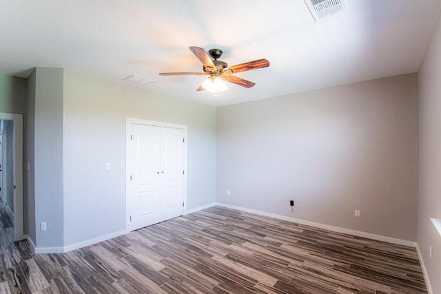 121 Grassy Ln, Elgin, TX 78621 - unfurnished room featuring a ceiling fan and wood finished floors