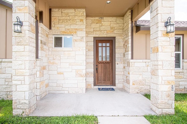 121 Grassy Ln, Elgin, TX 78621 - entrance to property featuring stone siding