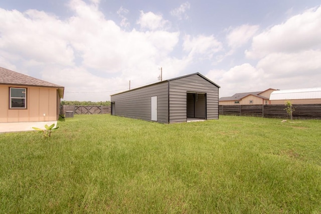 121 Grassy Ln, Elgin, TX 78621 - view of yard featuring an outbuilding