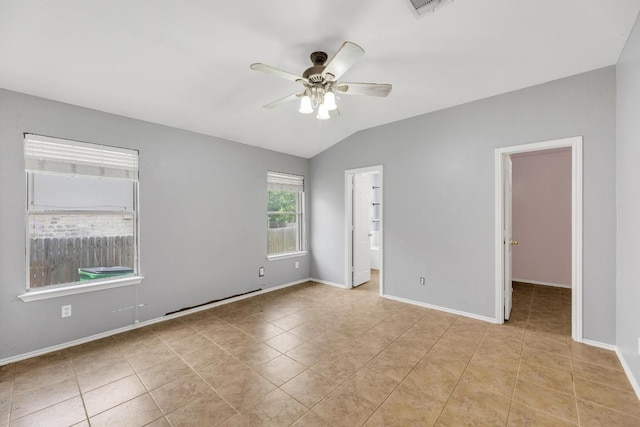 906 Mammoth Ct, Round Rock, TX 78681 - tiled empty room with a ceiling fan, vaulted ceiling, and baseboards