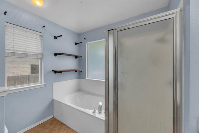 906 Mammoth Ct, Round Rock, TX 78681 - full bathroom featuring a stall shower, a bath, tile patterned floors, and baseboards