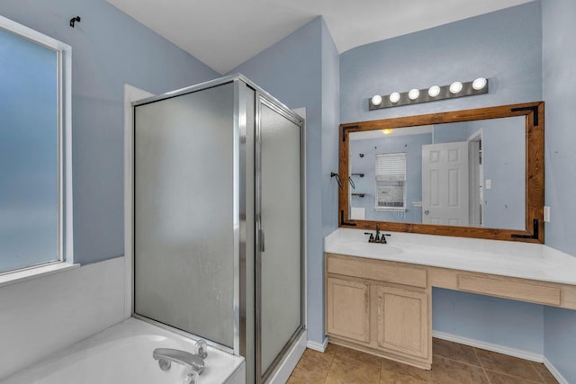 906 Mammoth Ct, Round Rock, TX 78681 - bathroom with a stall shower, vanity, a bath, and baseboards