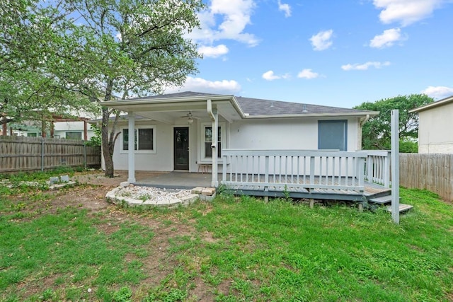 906 Mammoth Ct, Round Rock, TX 78681 - view of front of property with a wooden deck, ceiling fan, a shingled roof, a patio area, and stucco siding