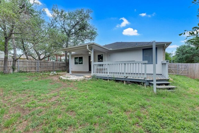 906 Mammoth Ct, Round Rock, TX 78681 - back of house with a wooden deck, stucco siding, and a patio
