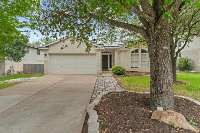 906 Mammoth Ct, Round Rock, TX 78681 - ranch-style home with a garage, concrete driveway, brick siding, and a front lawn