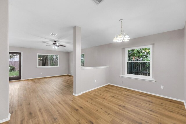 906 Mammoth Ct, Round Rock, TX 78681 - spare room featuring plenty of natural light, a chandelier, light wood-style flooring, and baseboards