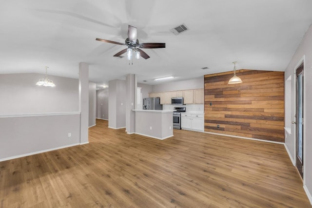 906 Mammoth Ct, Round Rock, TX 78681 - unfurnished living room with vaulted ceiling, light wood-style floors, ceiling fan, a chandelier, and baseboards