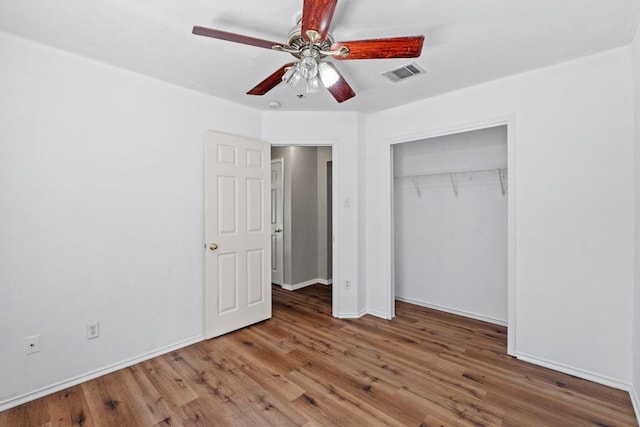 906 Mammoth Ct, Round Rock, TX 78681 - unfurnished bedroom featuring wood finished floors, baseboards, a closet, and ceiling fan