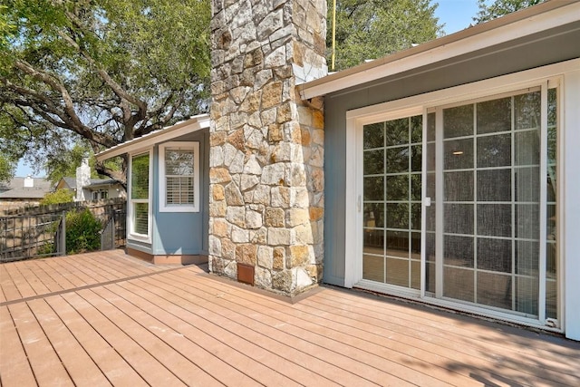wooden deck featuring fence