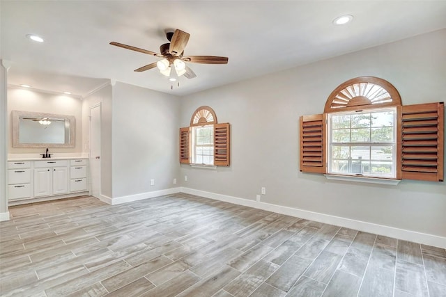 empty room with a ceiling fan, baseboards, light wood-style floors, and recessed lighting