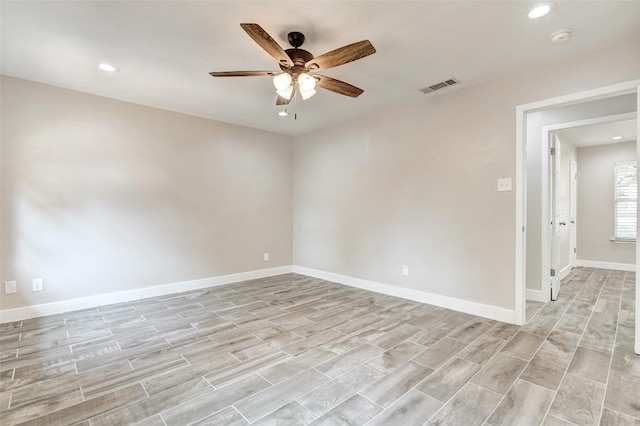 empty room with ceiling fan, recessed lighting, baseboards, light wood-style floors, and a smoke detector