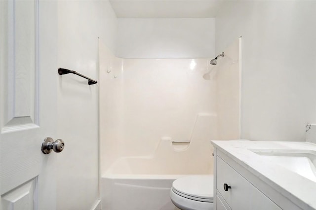 bathroom with toilet, bathing tub / shower combination, and vanity