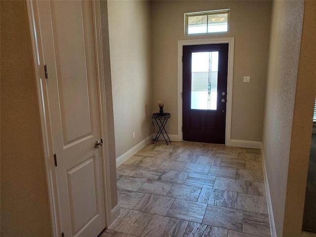 539 Tanda Ln, Hutto, TX 78634 - entryway with baseboards and stone tile floors