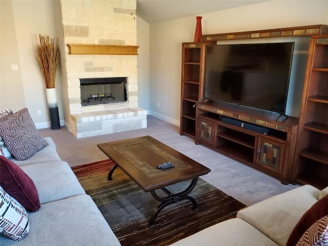539 Tanda Ln, Hutto, TX 78634 - carpeted living room featuring a fireplace, baseboards, and vaulted ceiling