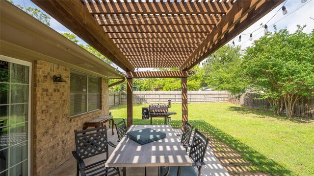 view of patio featuring a pergola and outdoor dining area