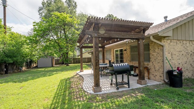 view of yard with a shed, a patio area, a pergola, and an outdoor structure