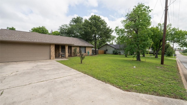 ranch-style home featuring a garage, driveway, a front lawn, and brick siding
