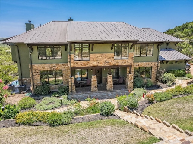 400 Hillview Rd, Wimberley, TX 78676 - rear view of property with a standing seam roof, a chimney, metal roof, a patio, and central air condition unit