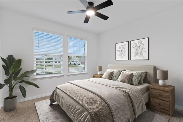 bedroom with baseboards, carpet flooring, and a ceiling fan
