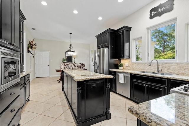 1016 High Hill Creek Rd, La Grange, TX 78945 - kitchen featuring dark cabinetry, stainless steel appliances, a sink, a center island, and recessed lighting