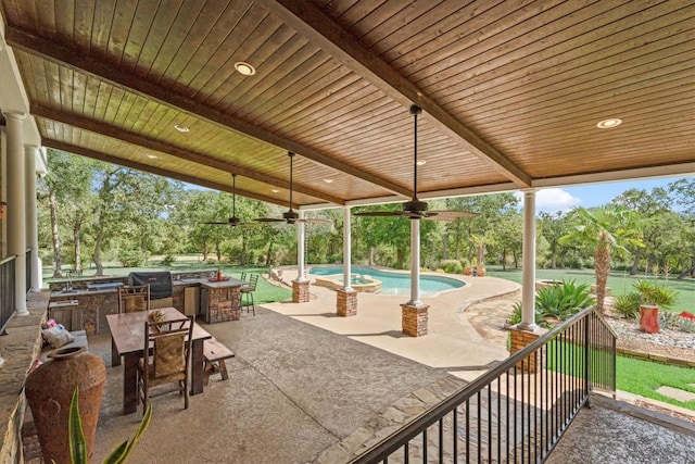 1016 High Hill Creek Rd, La Grange, TX 78945 - view of patio with ceiling fan, an outdoor pool, view of wooded area, and outdoor dining area
