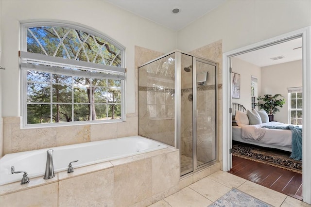 1016 High Hill Creek Rd, La Grange, TX 78945 - full bathroom with tile patterned floors, ensuite bath, a stall shower, and a garden tub