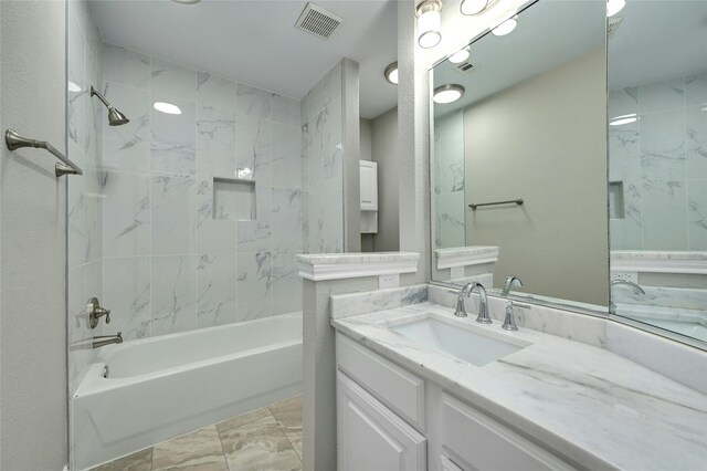 4933 China Garden Dr, Austin, TX 78730 - full bathroom featuring vanity, shower / tub combination, and marble finish flooring