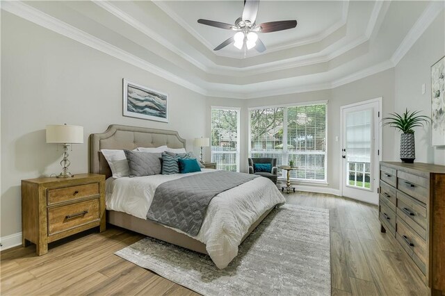 4933 China Garden Dr, Austin, TX 78730 - bedroom with a raised ceiling, light wood-style floors, access to exterior, crown molding, and ceiling fan
