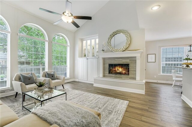 4933 China Garden Dr, Austin, TX 78730 - living area featuring plenty of natural light, a ceiling fan, a fireplace, baseboards, and high vaulted ceiling