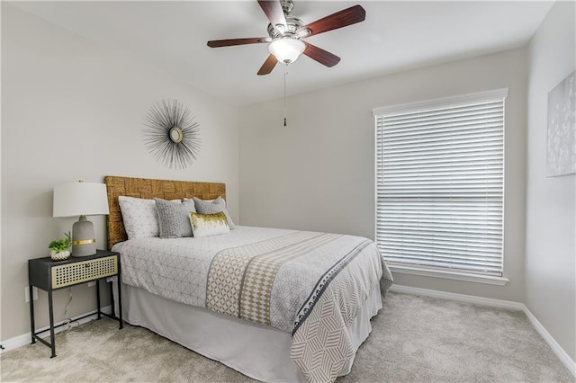 4933 China Garden Dr, Austin, TX 78730 - carpeted bedroom with baseboards, a ceiling fan, and multiple windows