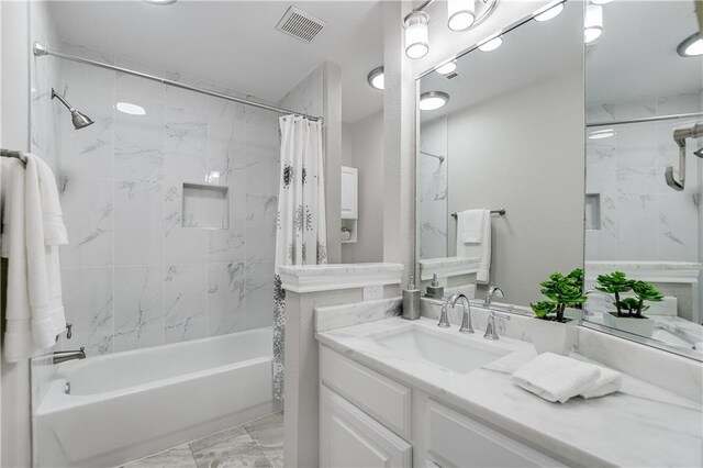 4933 China Garden Dr, Austin, TX 78730 - bathroom with shower / bath combo with shower curtain, vanity, and marble finish flooring